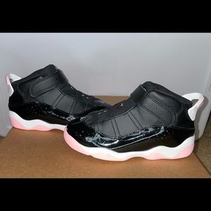 Jordan Retro 11s - Black/White/Pink
